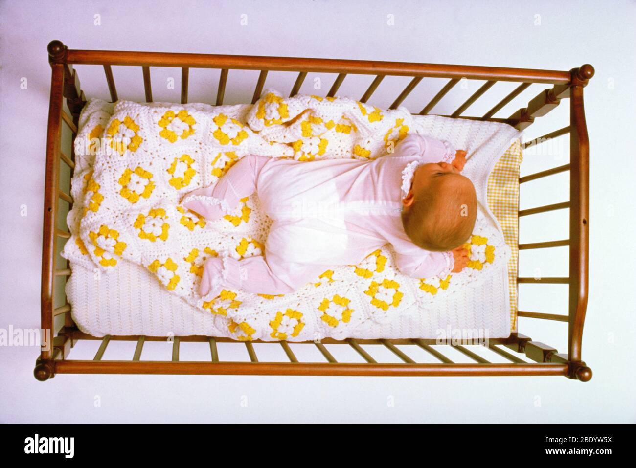 Baby in a crib Stock Photo