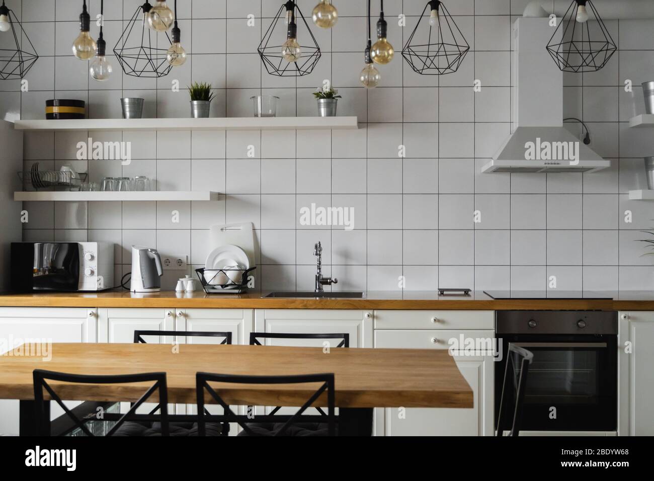 Modern, bright, clean, kitchen interior with stainless steel appliances ...