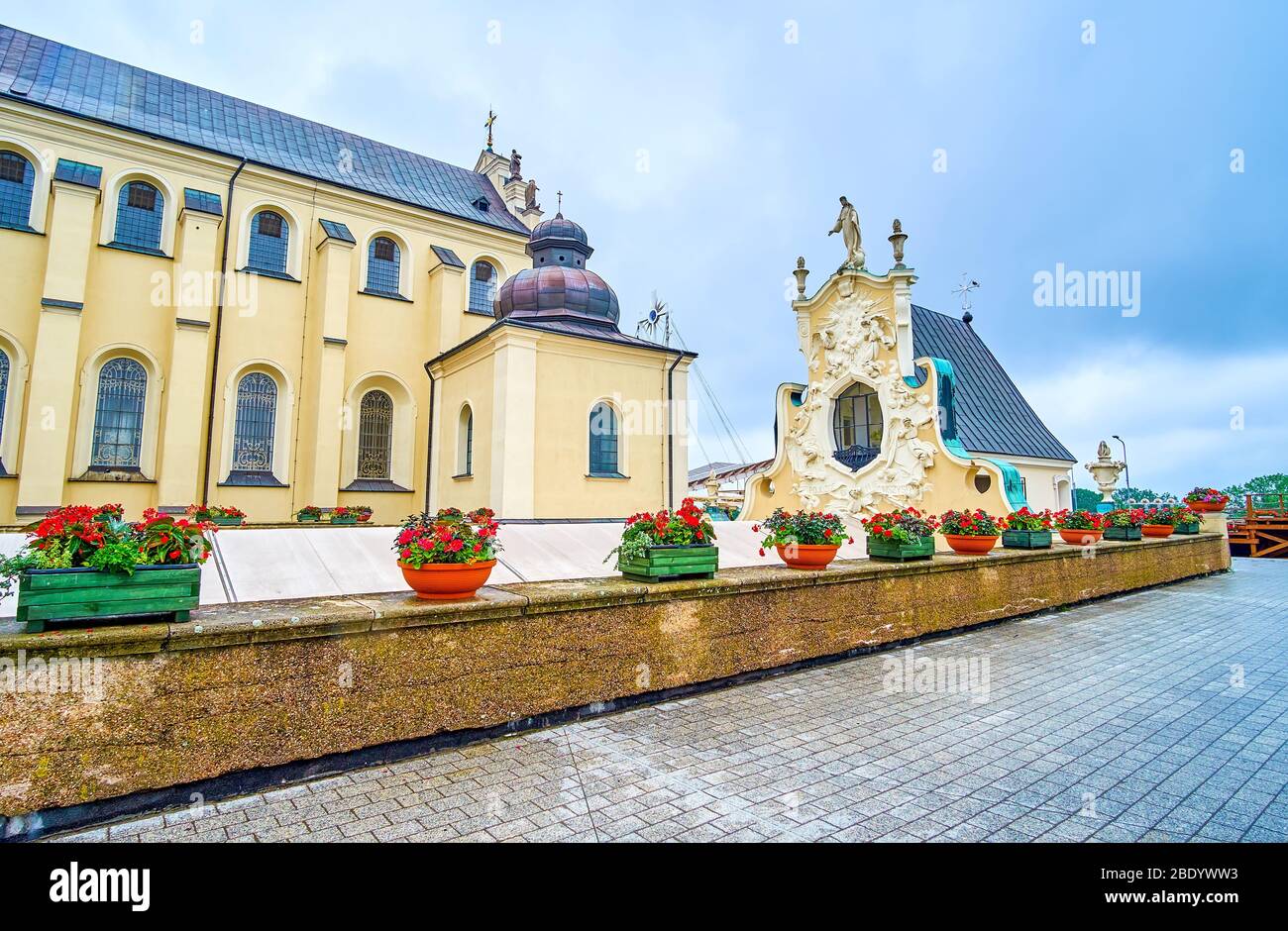The courtyard of Jasna Gora monastery with facade of small church decorated with amazing stucco molding, Jasna Gora in Czestochowa, Poland Stock Photo