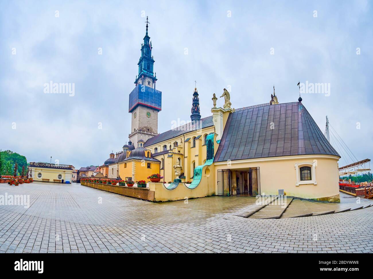 Panorama of the courtyard of Jasna Gora monastery complex with the entrance to Treasury in medieval chapel on the foreground, Czestochowa, Poland Stock Photo