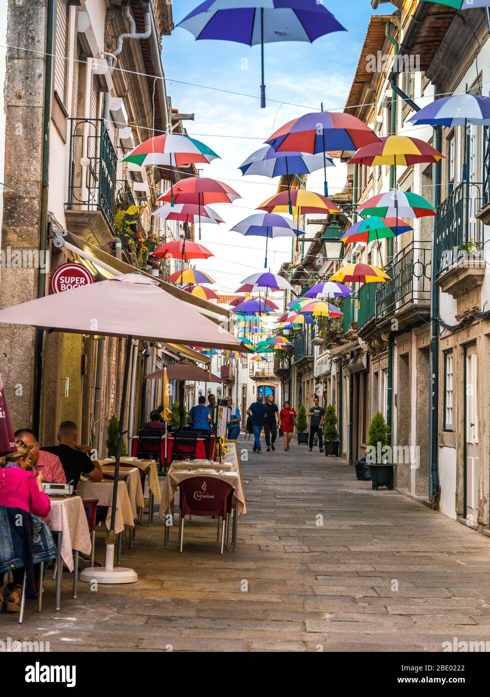 Hanging coloured umbrellas in narrow street of Viana Do Castelo Northern Portugal Stock Photo