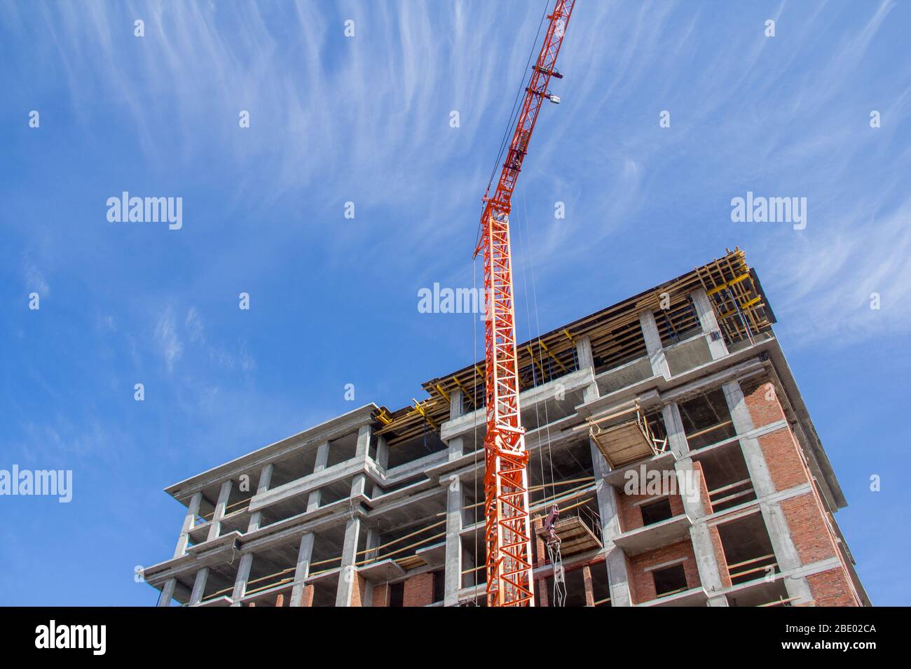 The facade of the building under construction is made of concrete frame ...