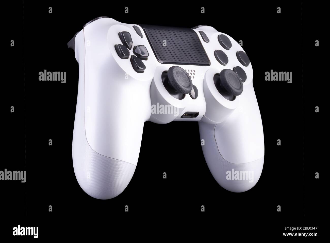 White video game joystick gamepad isolated on a black background Stock ...