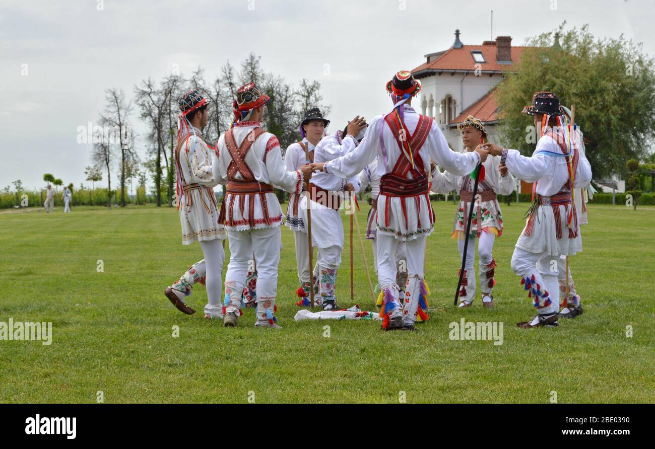 Romanian traditional customs - men dressed in rustic clothes performing  festive dancing called "Dansul Calusarilor" after Easter - Dragasani, Dolj  / R Stock Photo - Alamy