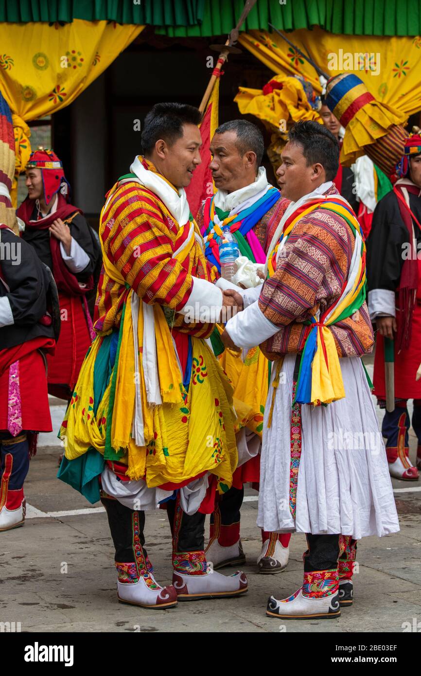 Bhutan, Punakha Dzong. Punakha Drubchen Festival, performers in traditional attire. Stock Photo