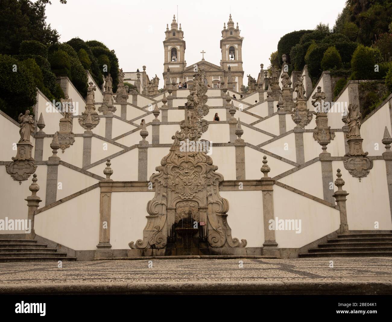 Stairway of the Five Senses: Vision, Hearing, Smell, Taste and Touch depicting the ascent to heaven at Bom Jesus do Monte is a Portuguese Stock Photo