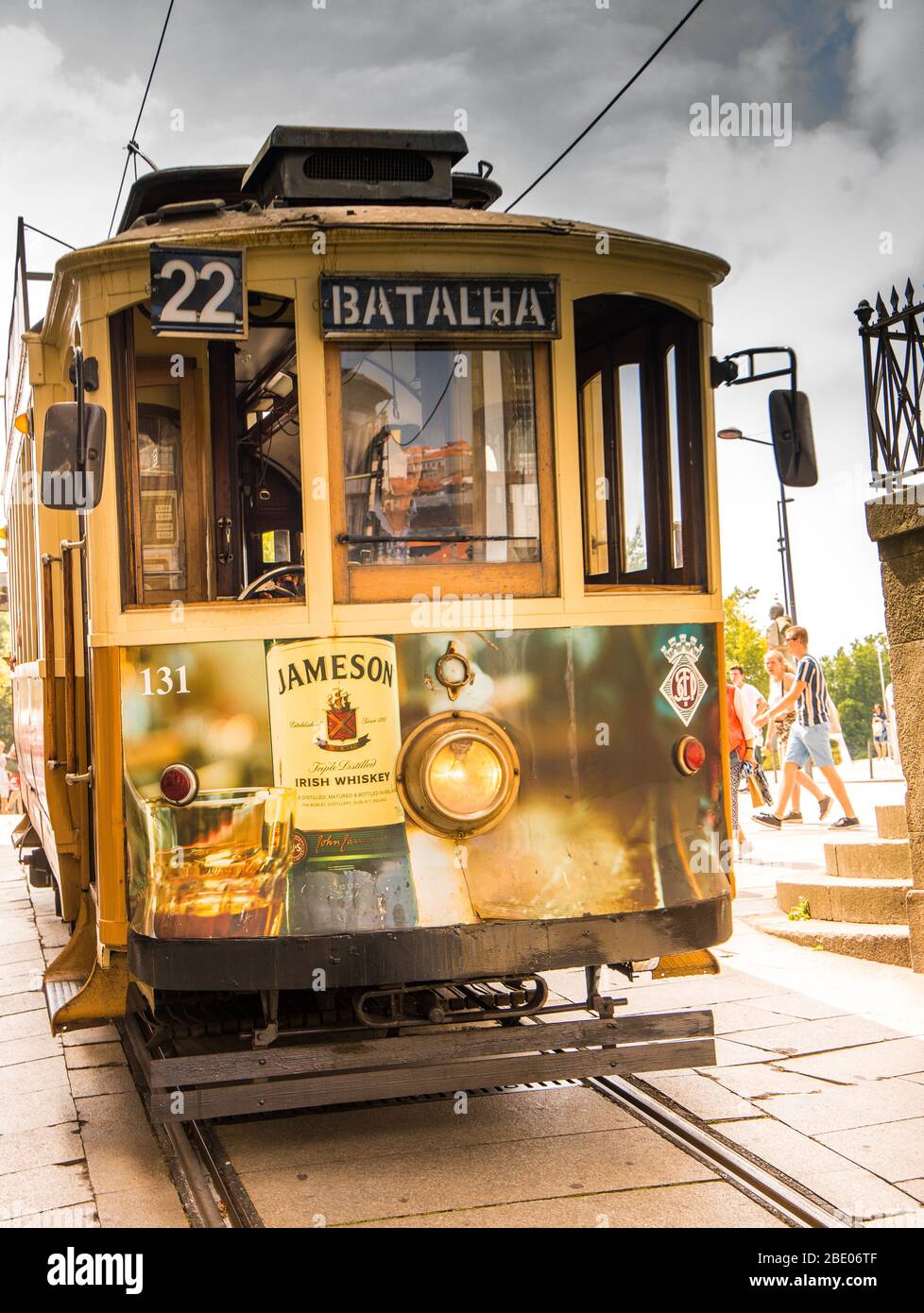 Traditional tram in Porto Portugal with advertisement for Jameson Whiskey on the front Stock Photo