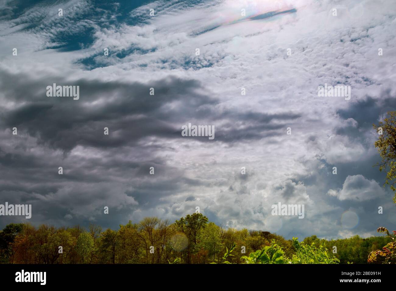 Landscape with winding storm clouds over trees and forest Stock Photo ...