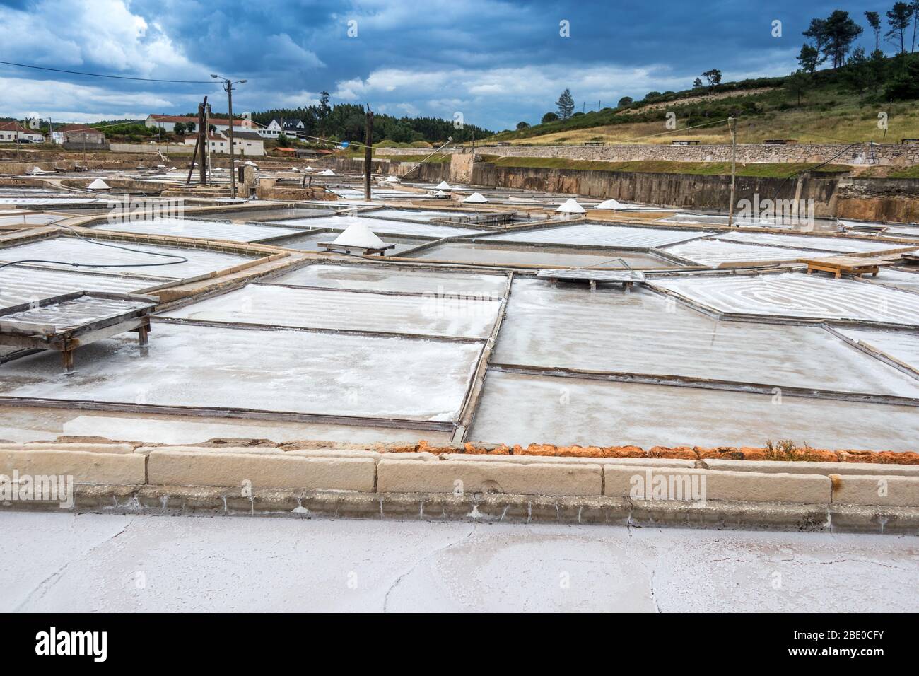 Salt production using traditional method from the salt springs (inland salinas) at Rio Maior Salt Pans Portugal. Stock Photo