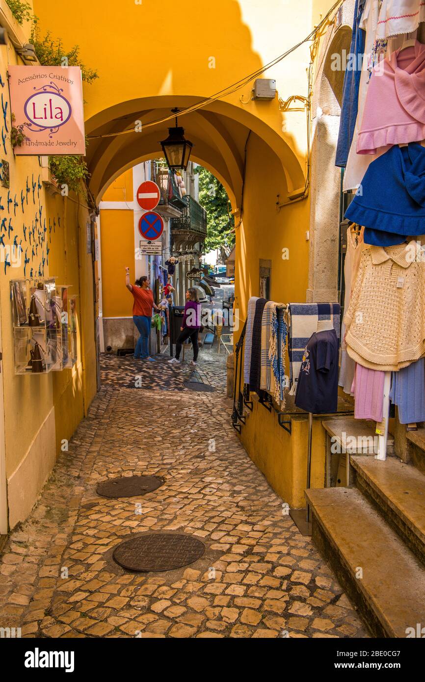 Narrow street view with archway and shops in Sintra Portugal Stock ...