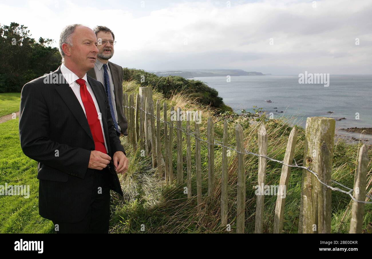 The Irish Minister fo Foreign Affairs, Dermot Ahern, T.D. looks out along the North Antrim Coast with Corrymeela Reconciliation Centre Director David Stevens, during a visit to Ballycastle,  Northern Ireland, 22 Sept, 2005. Minister Ahern visited a number of community groups in Belfast and Antrim who were most directly affected sectarian attacks and street violence. (Irish Foreign Office Hand Out Photo/Paul McErlane) Stock Photo