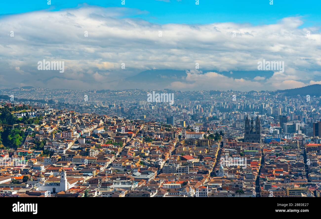 Aerial Panorama of Quito City with the historic city center in the foreground and the modern skyscrapers in the background, Ecuador. Stock Photo