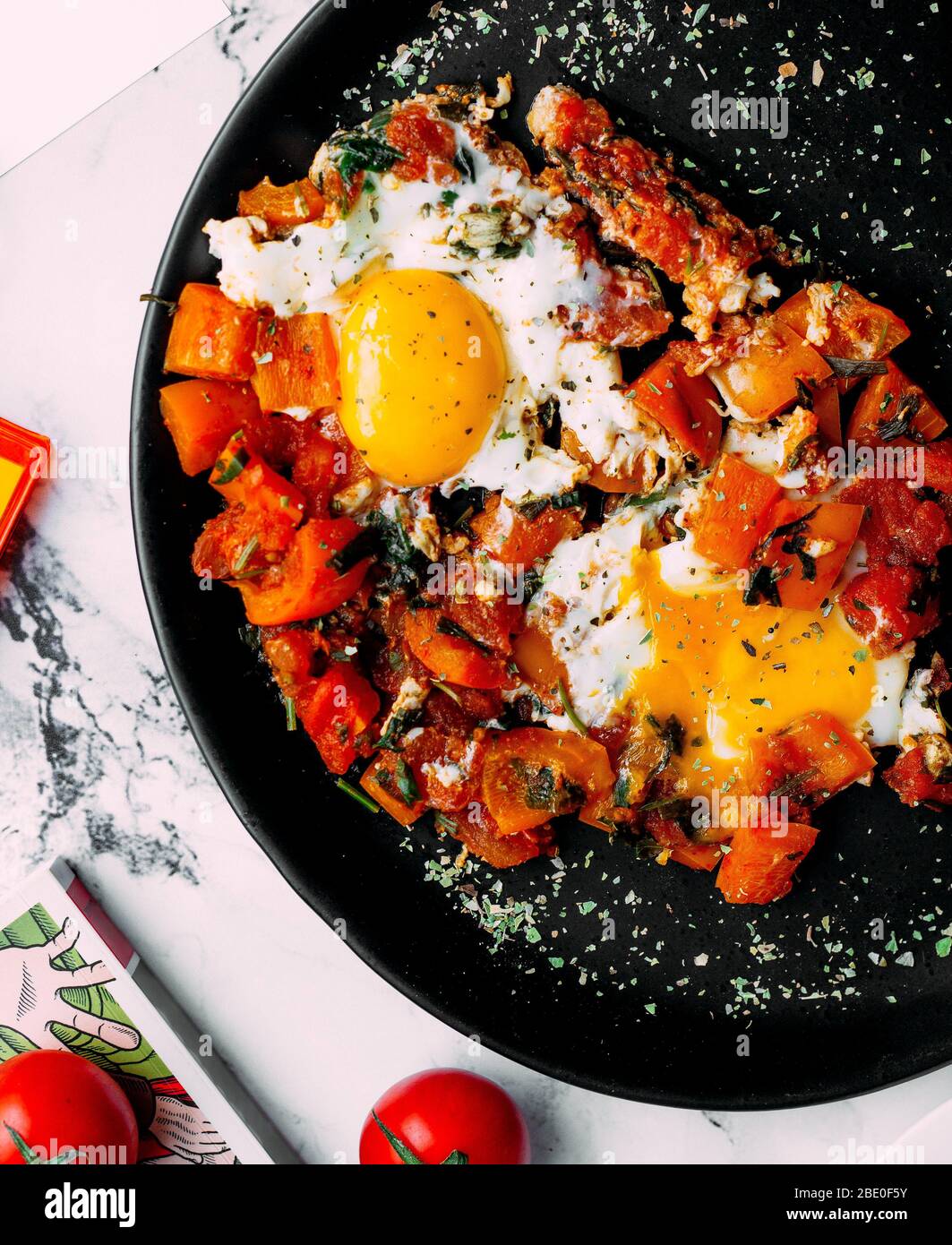 vegetables with herbs and fried eggs Stock Photo