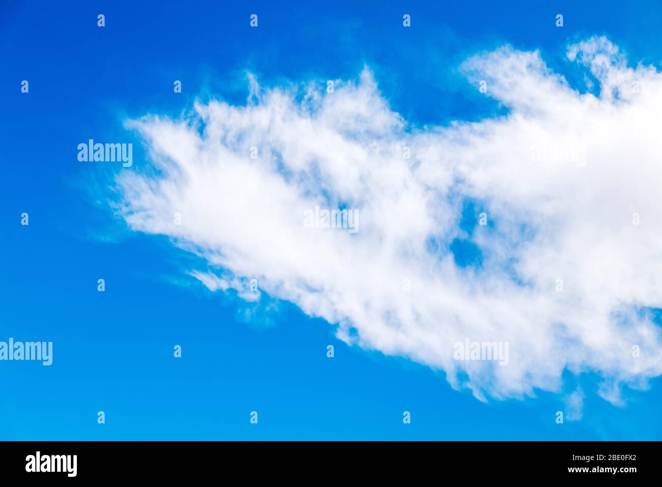 Unusual cloud formations against clear cobalt blue sky; central Colorado; USA Stock Photo