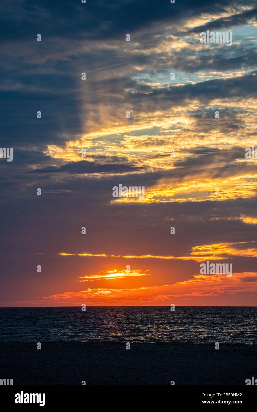 Beautiful sunset sky colors and lights above beach Stock Photo Alamy