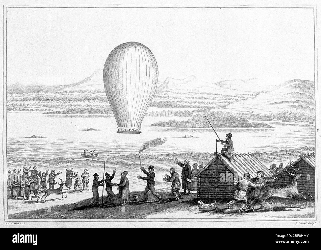 The natives of Tornea Lapmark, assembled at Enontekis in Lapland to witness the launch of the first Balloon within the Arctic Circle. From 'Travels in various countries of Europe Asia and Africa' by Edward Daniel Clarke. Published: 1819. A man sitting on the roof of a store house is holding a pole from which the balloon had been suspended; another man holds a stick burning at one end from generating the heat to inflate the balloon. Many Laplanders in foreground watch the balloon ascension while reindeer, frightened by the balloon, scamper off. Stock Photo