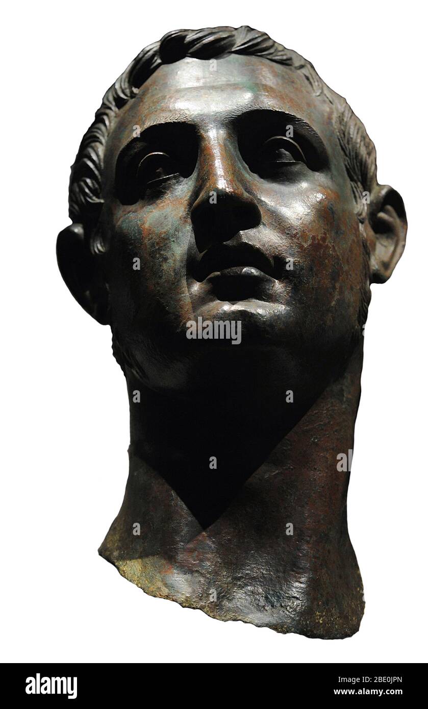 Head of a young man, part of a sculptural group. Stock Photo