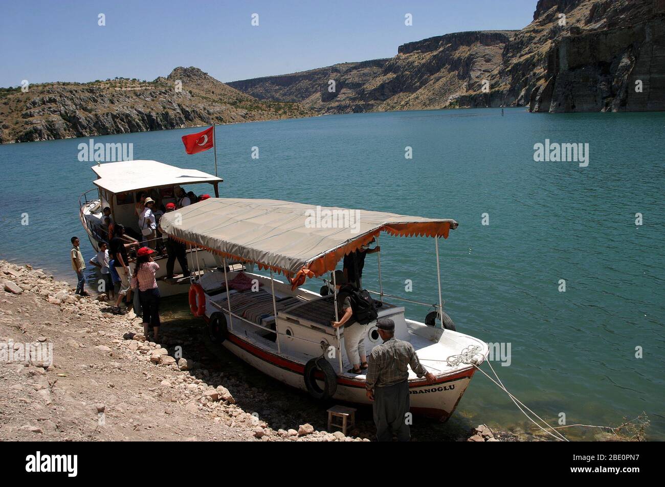 FIRAT RIVER, TURKEY - JANUARY 06: Tourists waiting river boat in Firat River Coastline (Euphrates River) on January 06, 2000 in Gaziantep, Turkey. Stock Photo