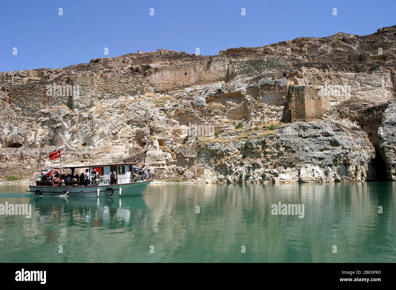 FIRAT RIVER, TURKEY - JANUARY 06: River boat in front of abandoned castle (Rum Kale) in Firat River (Euphrates River) on January 06, 2000 in Gaziantep, Turkey. Stock Photo
