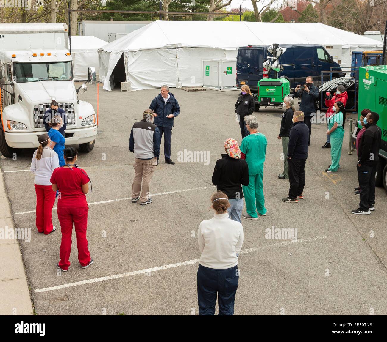 New York, United States. 10th Apr, 2020. Mayor Bill De Blasio greets health care workers who came from different parts of America to help with COVID-19 outbreak in NYC outside of temporary hospital located at indoor courts of USTA Billie Jean King National Tennis Center (Photo by Lev Radin/Pacific Press) Credit: Pacific Press Agency/Alamy Live News Stock Photo