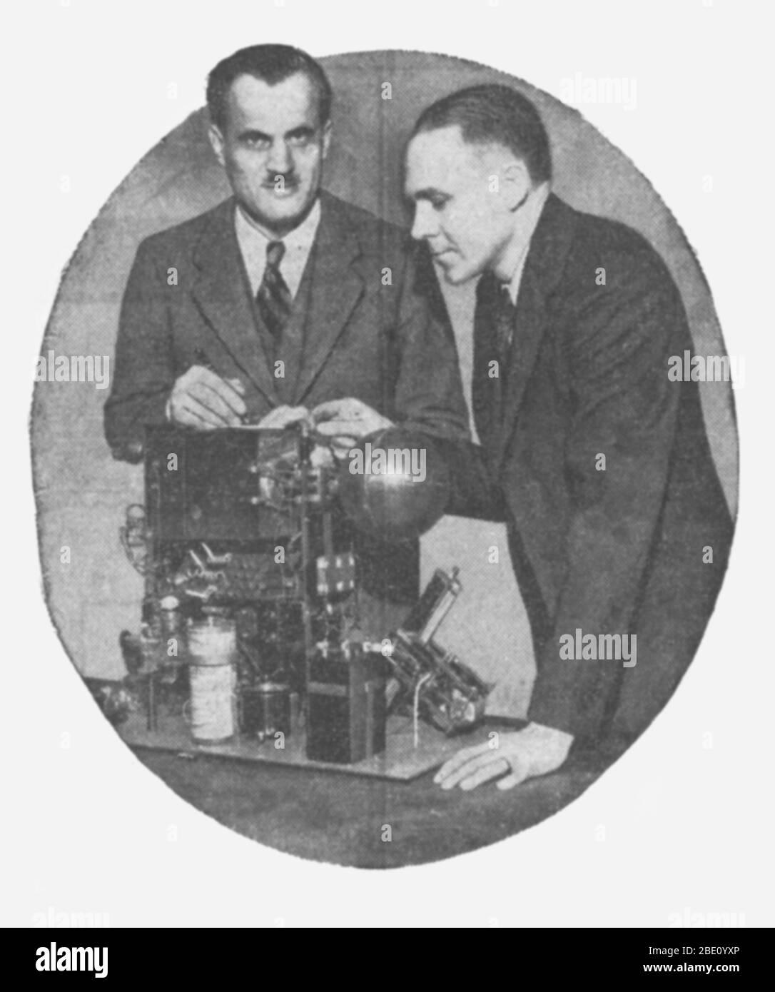 Compton (left) and his assistant, Richard Doan, look over equipment that Compton built for recording the intensity of cosmic rays in the stratosphere. The equipment will be carried into the stratosphere on a balloon and the measurements will be transmitted to the ground by radio. Arthur Holly Compton (September 10, 1892 - March 15, 1962) was an American physicist. In 1919, Compton was awarded a National Research Council Fellowship that allowed students to study abroad. He chose the Cavendish Laboratory in England, where he studied the scattering and absorption of gamma rays which led to the di Stock Photo
