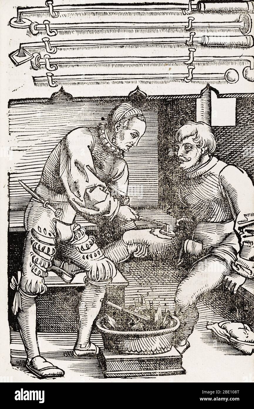 A historical woodcut by J. Wechtlin showing a doctor cauterizing a man's thigh. Published 1530. Cauterization is a method of staunching bleeding by burning the flesh in the region of the wound. In this scene a hot iron is being used without anesthetic. Between the two men is the fire where the irons are heated. Stock Photo