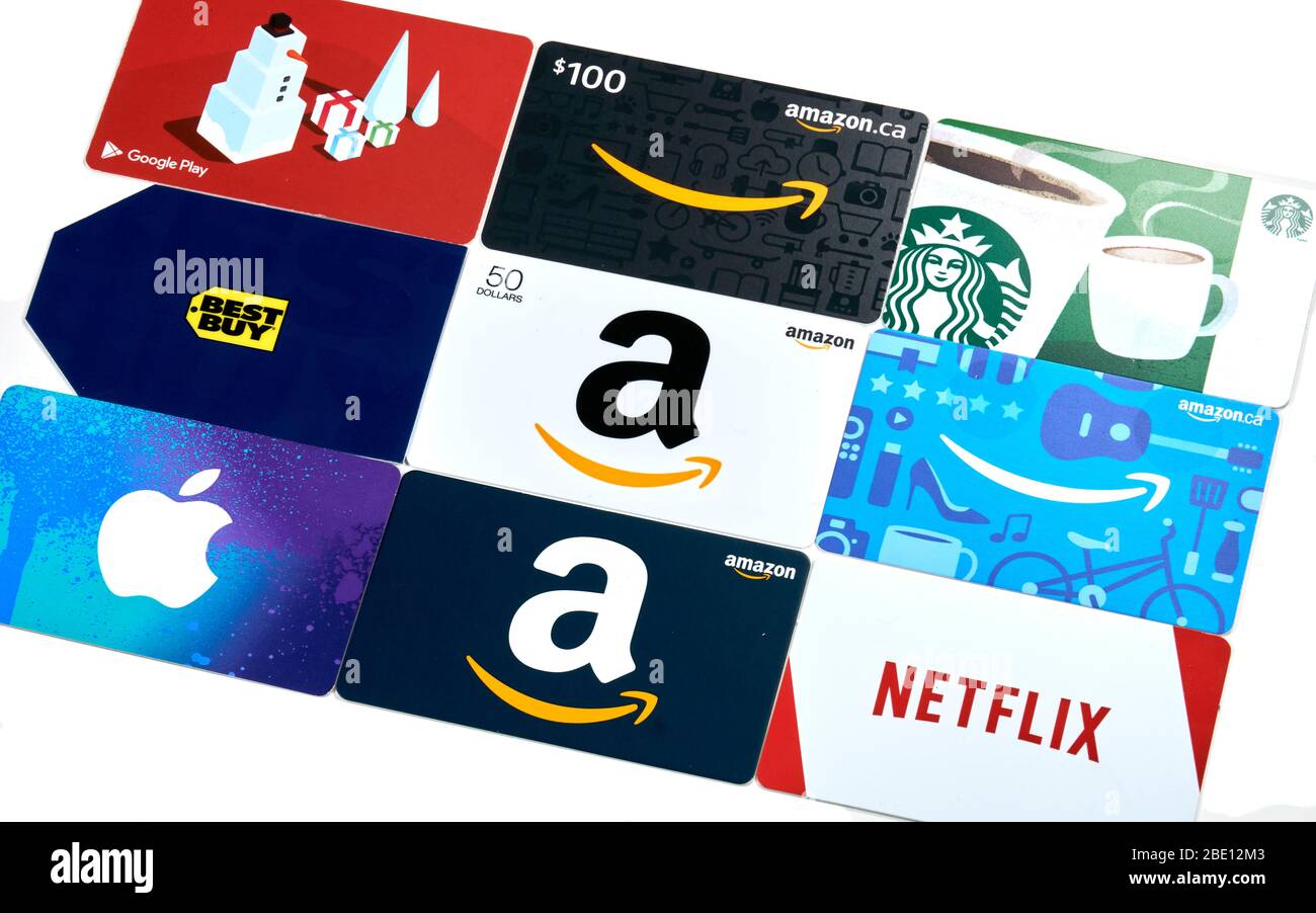 Montreal, Canada - April 9, 2020: Different gift cards of many brands such as Amazon, Netflix, Xbox, Google Play, Best Buy, Spotify, Starbucks. A gift Stock Photo