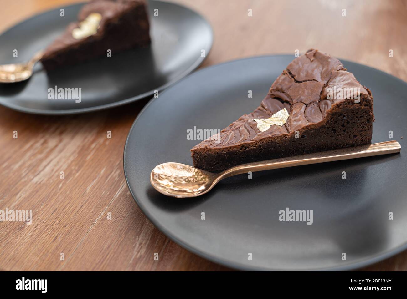 Close up. Dark chocolate brownie, home made style, dessert cake in bakery. Stock Photo