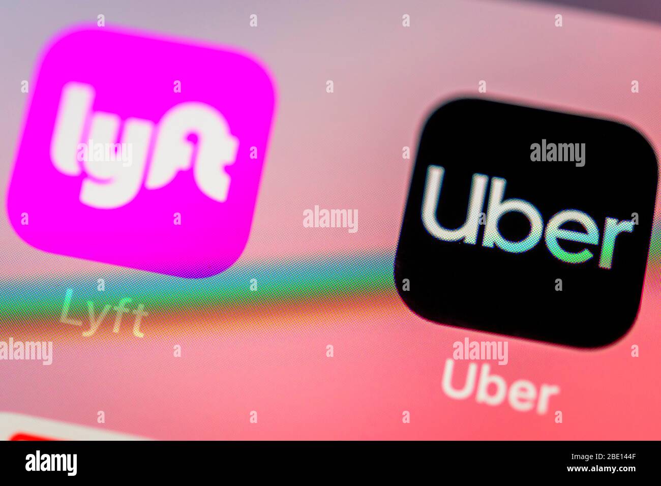 Uber and Lyft App, taxi service, icon, logo, display, iPhone, mobile phone, smartphone, iOS, macro shot, detail, full format Stock Photo