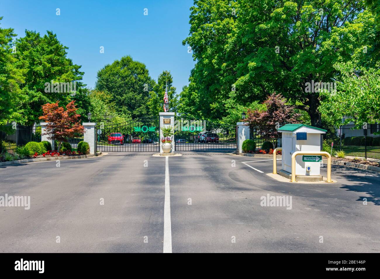Gated entrance to upscale suburban neighborhood in Midwest America Stock Photo