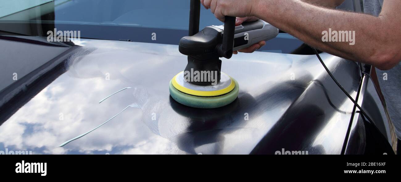 polishing a car with a machine Stock Photo Alamy