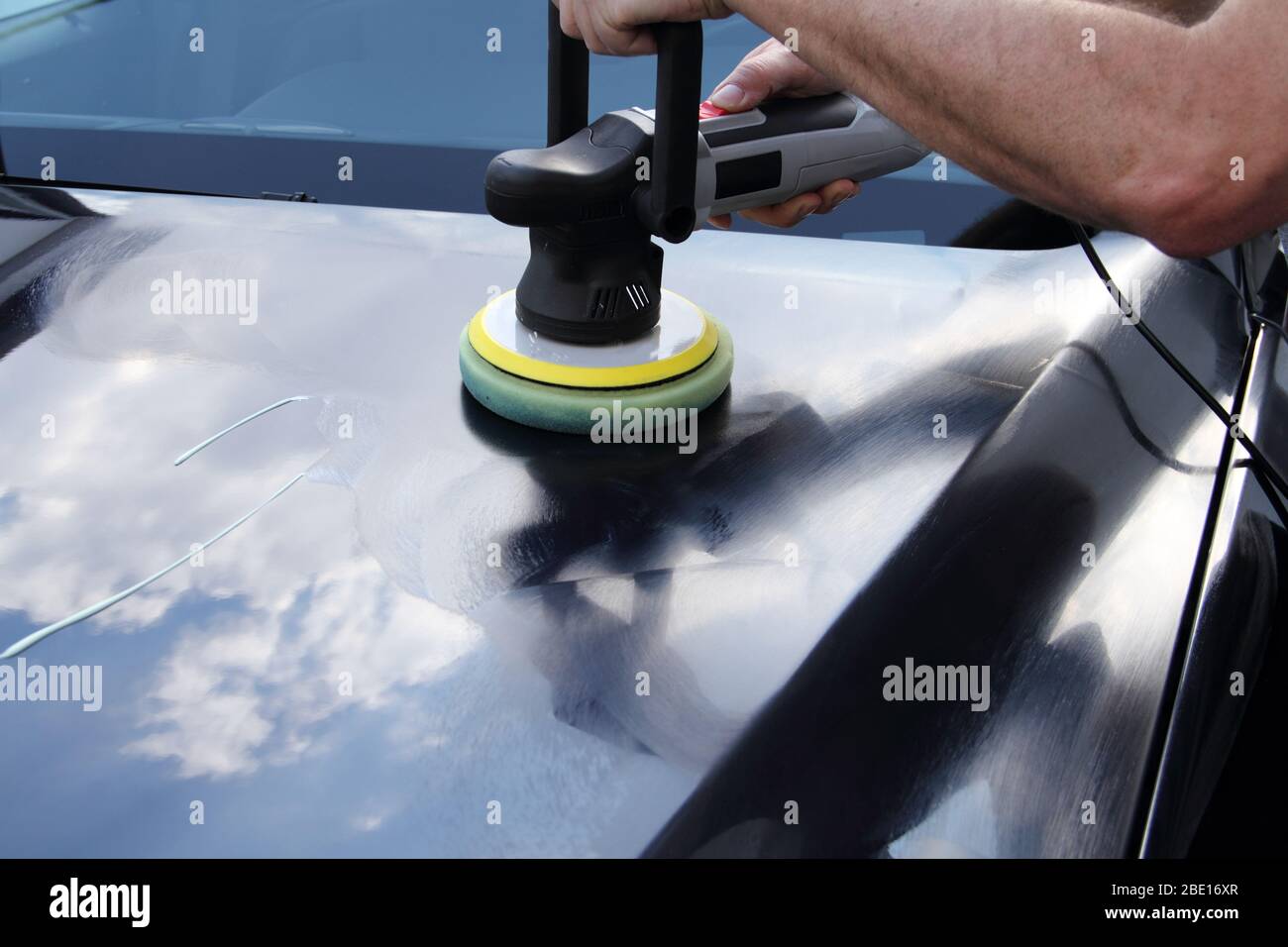 polishing a car with a machine Stock Photo Alamy