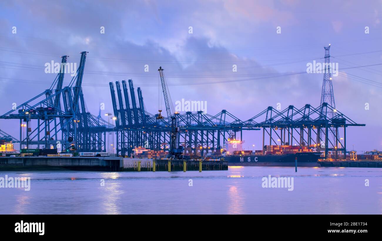 ANTWERP-AUG. 25, 2019. Illuminated container terminal at twilight. The ...