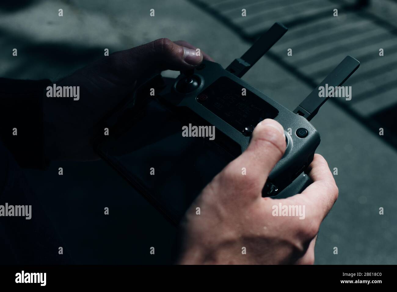 Drone remote control. Remote control in hand man. Man holds remote