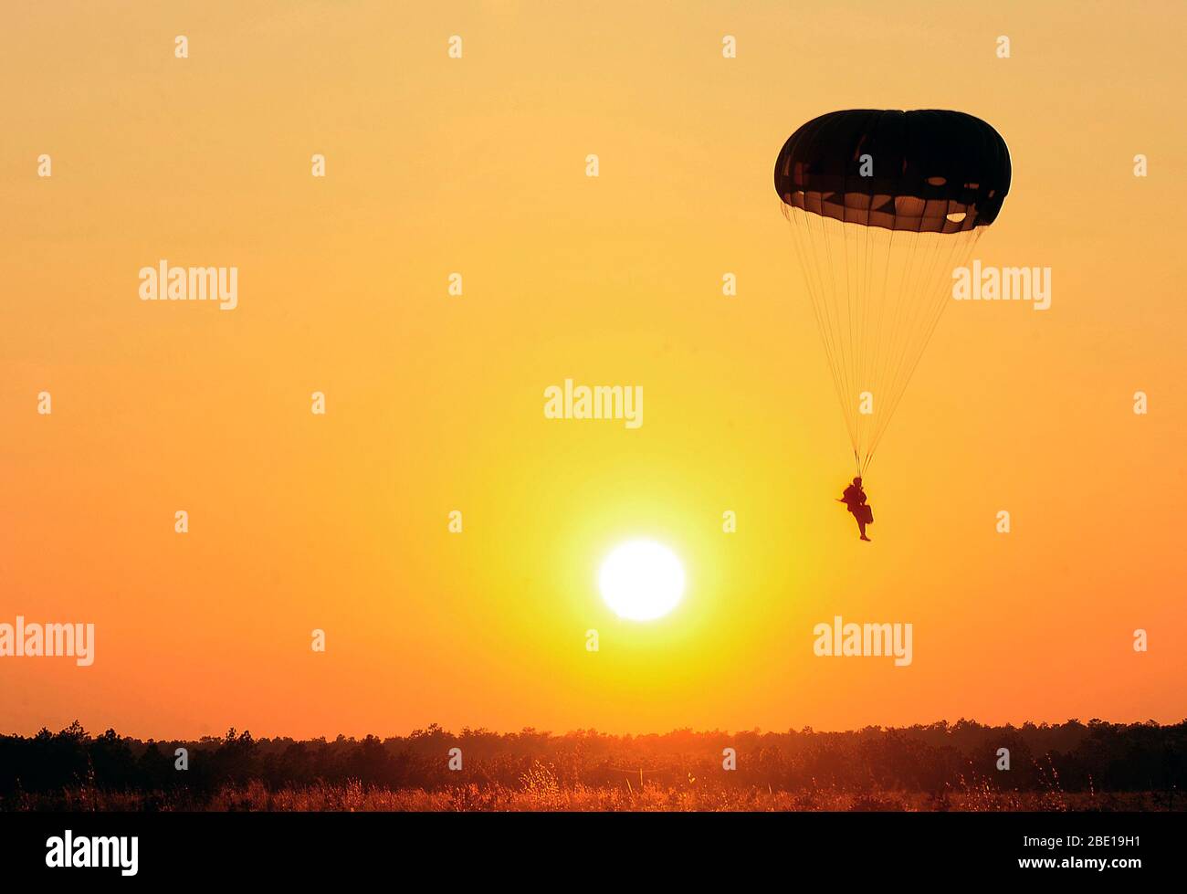 A U.S. Army Ranger assigned to the 6th Ranger Training Battalion parachutes during a static line jump Nov. 25, 2009, Camp Rudder, Fla. Stock Photo