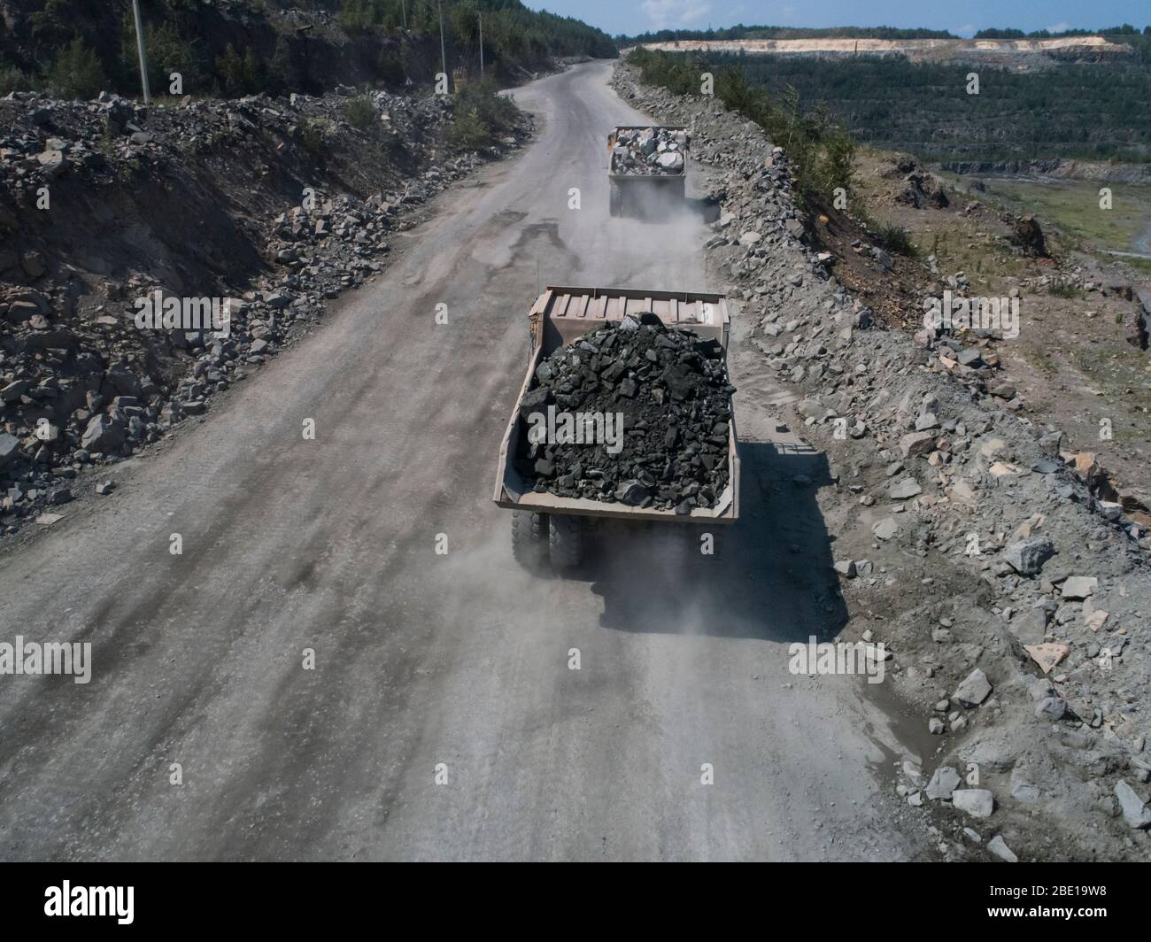 Huge industrial dump truck in a stone quarry from drone top shot Stock  Photo - Alamy