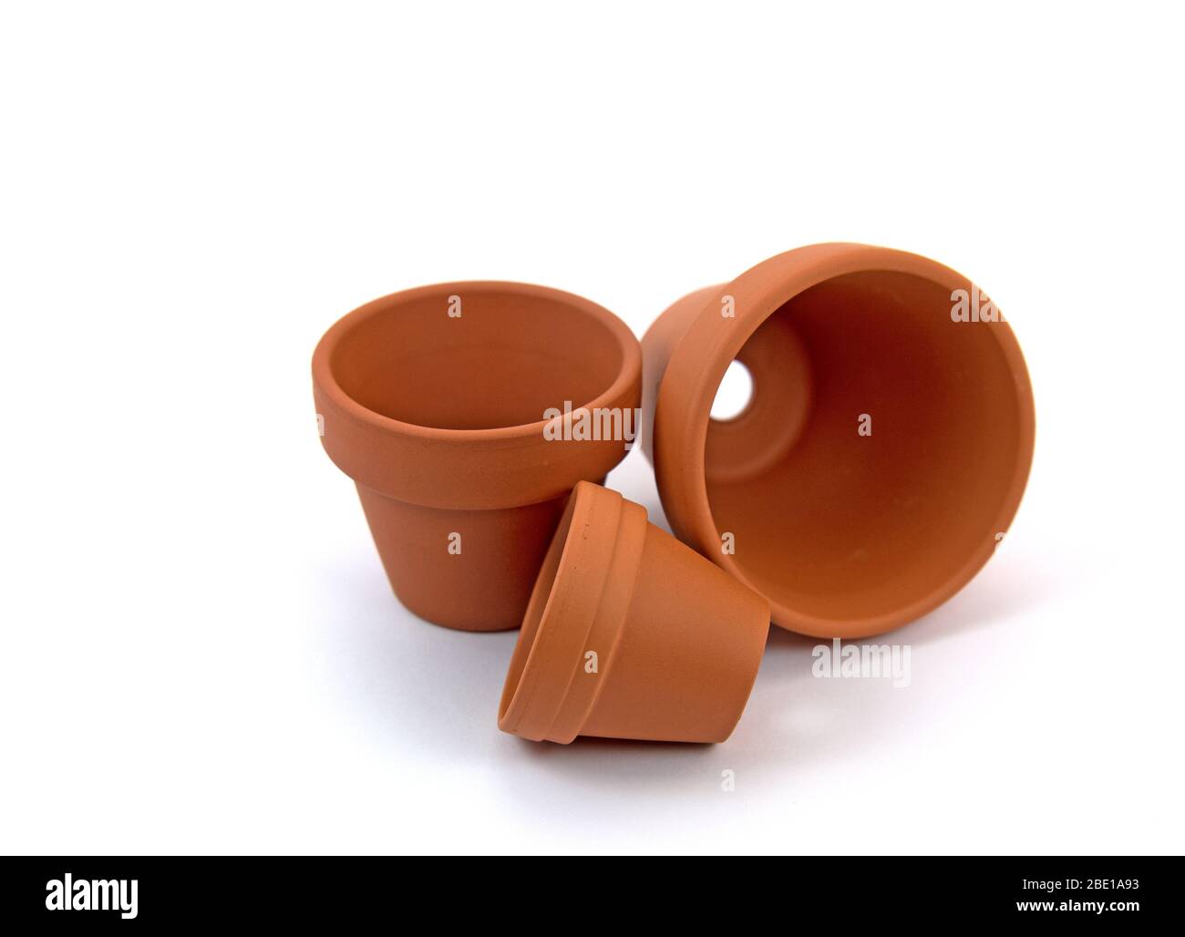 Empty flower pots against white background Stock Photo - Alamy