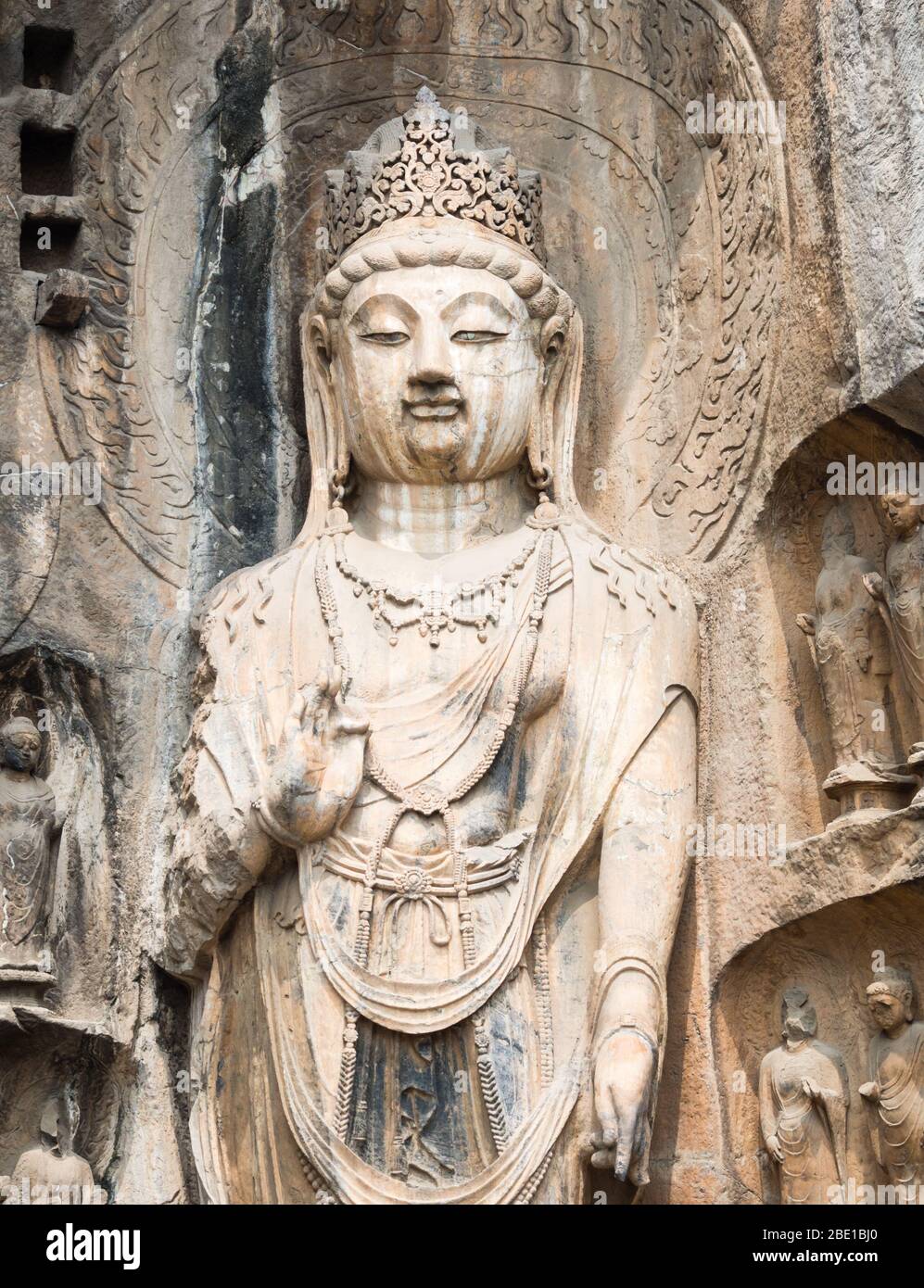 Stone buddhist statue in Longmen Grottoes, China Stock Photo - Alamy