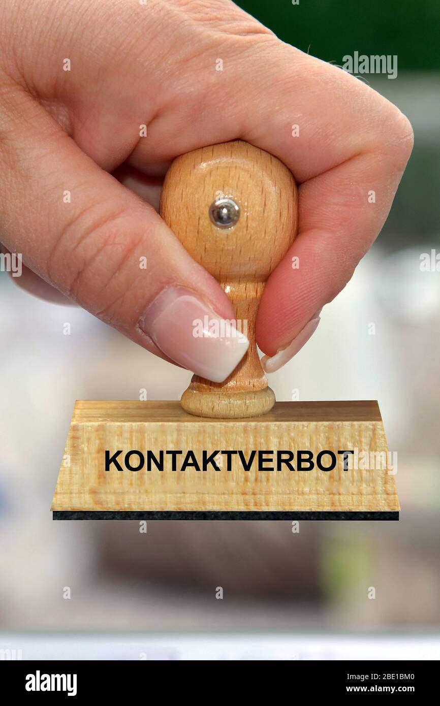 Hand mit Stempel, Frauenhand, Aufschrift: Kontaktverbot, Corona, Krise, Coronavirus, Pandemie, Stock Photo