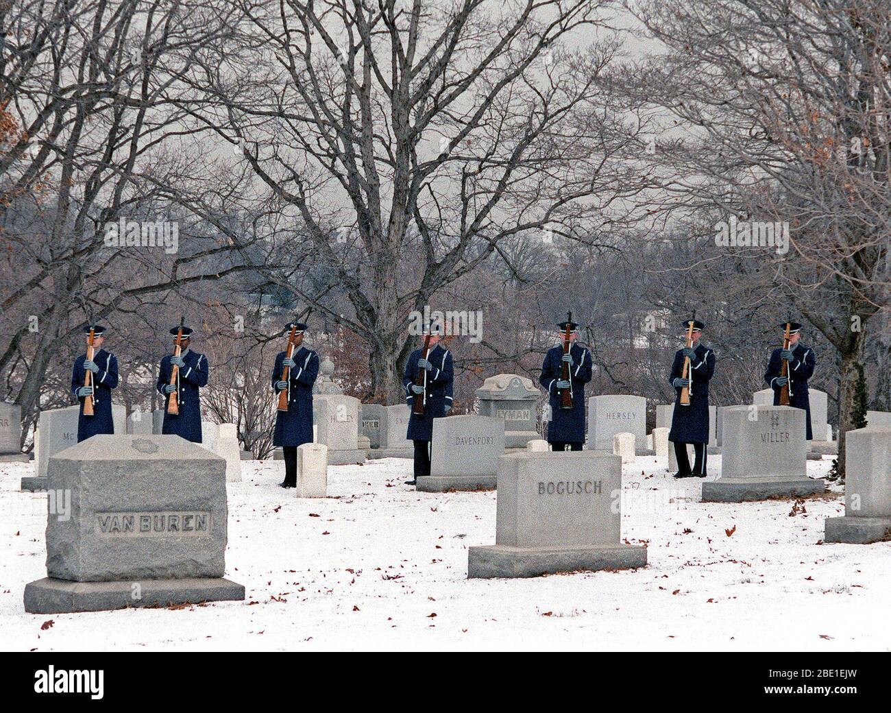 The Air Force Honor Guard fires a 21-gun salute at the conclusion of the graveside funeral service at Arlington National Cemetery. Stock Photo