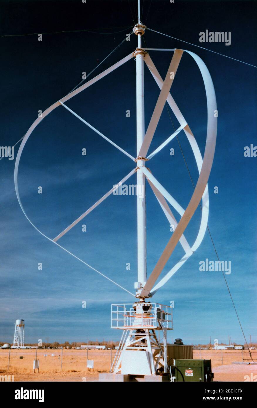 A view of a vertical axis wind turbine of the Darrieus design.  This machine is 17 meters high and produces up to 150 kilowatts of wind power. Stock Photo