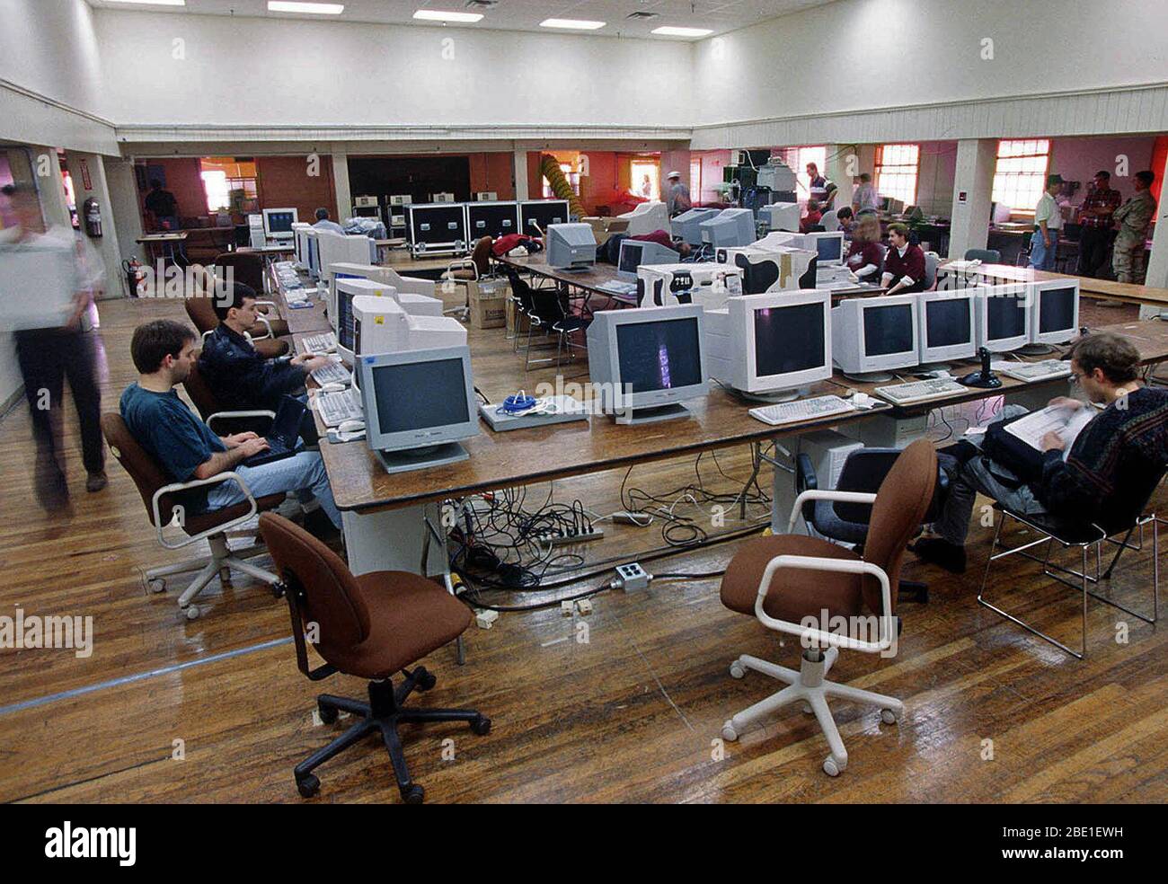 Computer operators and programmers prepare for the start of the world's ...