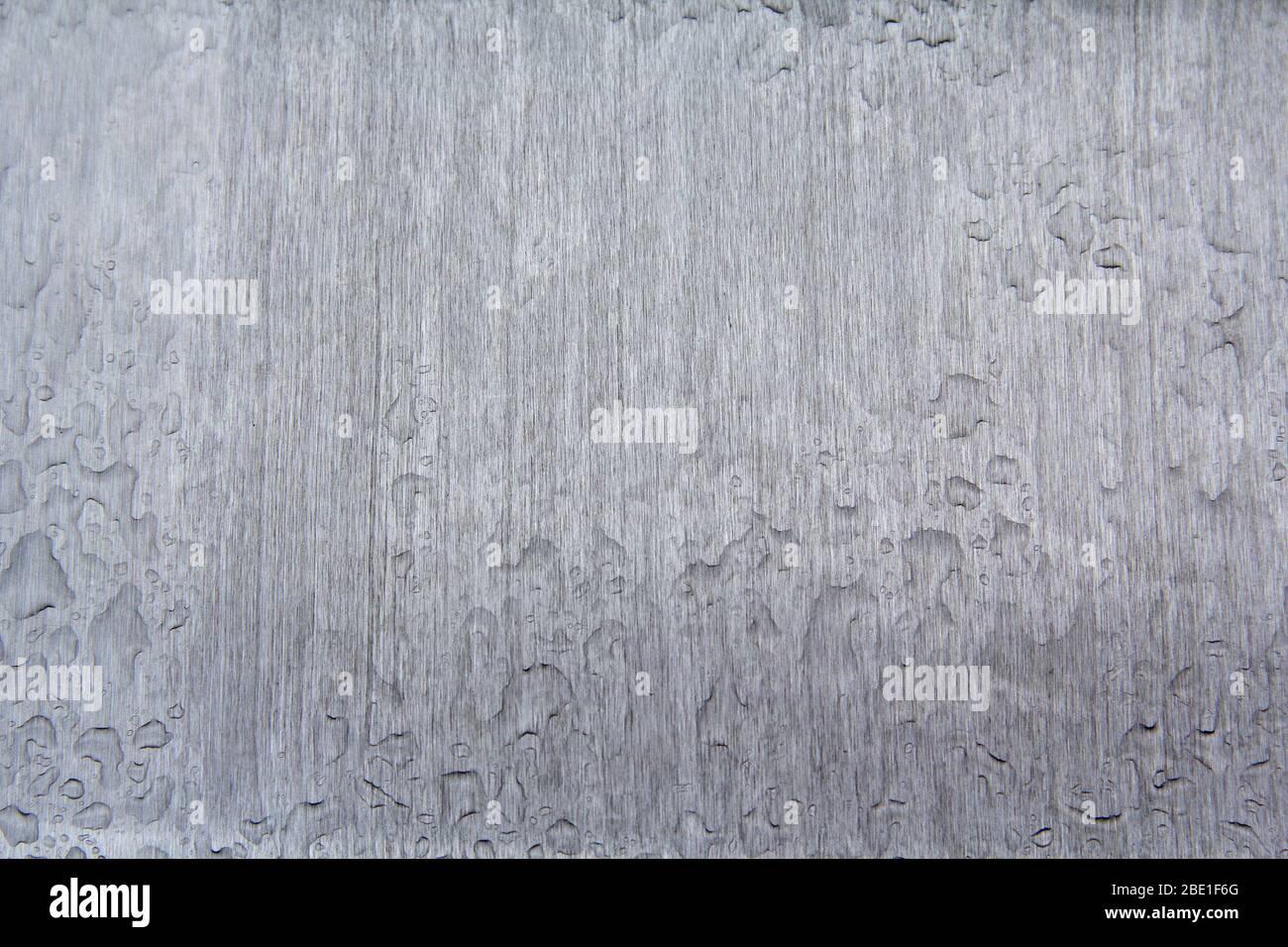 Rain drops on polished metal. Backgrounds and textures Stock Photo