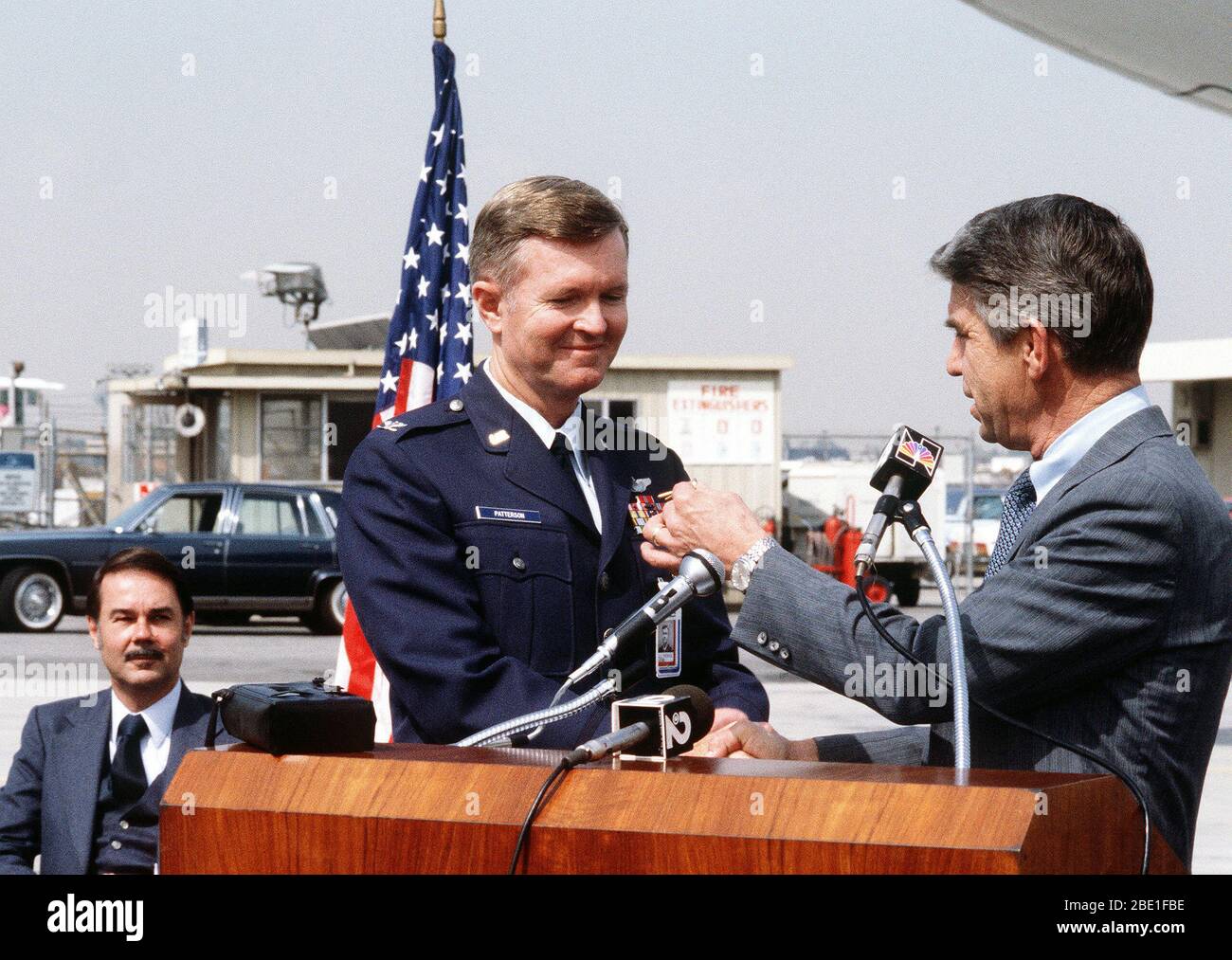 COL John Patterson, Air Force plant representative, accepts the keys from John C. Brizendine, president of McDonnell Douglas Corp., upon delivery of the first KC-10A Extender advanced tanker/cargo aircraft. Stock Photo