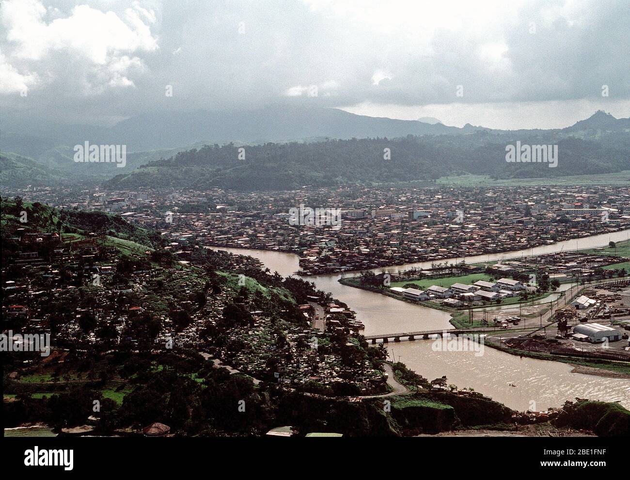 1981 - An aerial view of the city of Olongapo with the bridge leading to the U.S.  Naval Base, Subic  Bay, which is partially visible at bottom right. Stock Photo