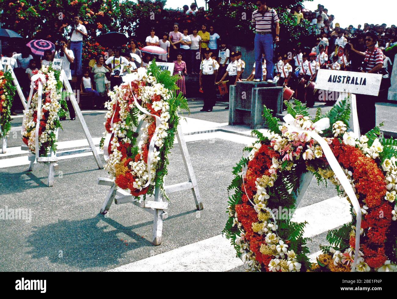 Wreaths of the unknown soldiers of Australia, the United States, Japan and the Philippines grace the sidewalk near the MacArthur Monument during ceremonies commemorating GEN Douglas MacArthur's return here 37 years ago.  MacArthur's return fulfilled his earlier and oft-quoted promise of 'I shall return'. Stock Photo