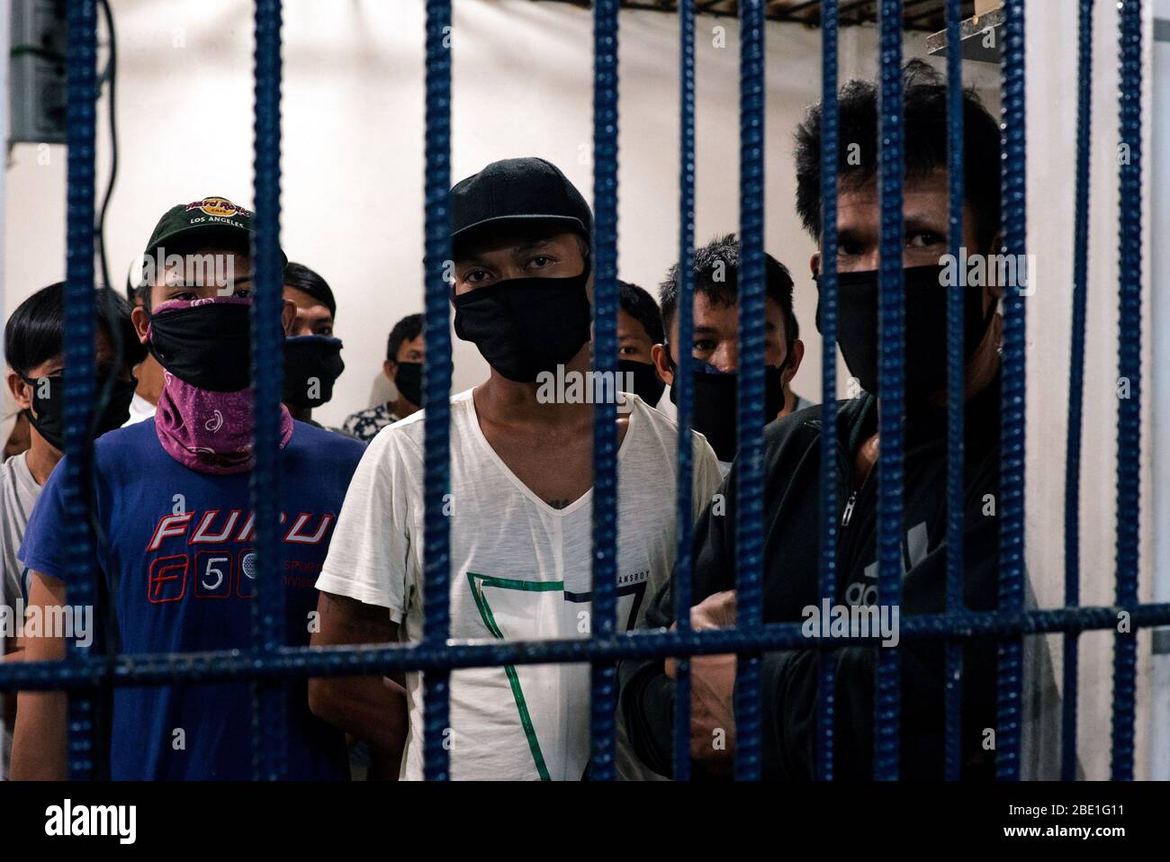 April 6, 2020 - Manila, National Captiol Region, Philippines - Detainees from Sitio San Roque, Quezon City await to be released on bail from Camp Karingal's detention center on April 6, 2020. Twenty-one residents were arrested for illegal assembly during an emergency health crisis during the enhanced community quarantine in Metro Manila to fight spread of COVID-19. On April 1, 2020, residents of Sitio San Roque gathered together to protest failings of the Duterte administration and local government to provide sufficient relief goods to their community. After a 15-minute warning, the Quezon Cit Stock Photo