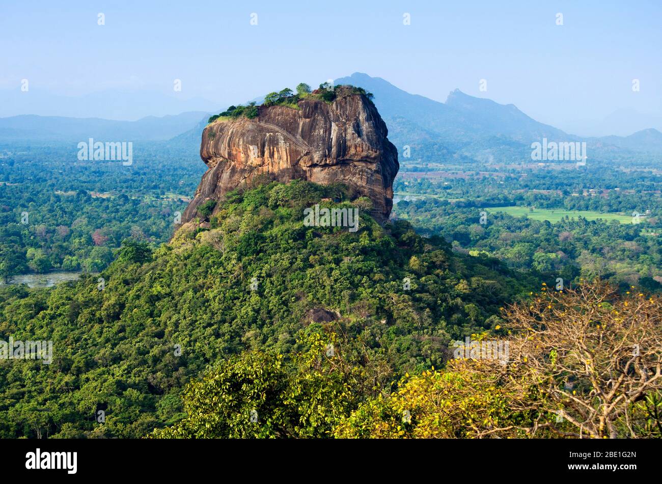 Sigiriya Rock towering above the Sri Lanka landscape, seen from Pidurangala Rock, Sri Lanka. Stock Photo