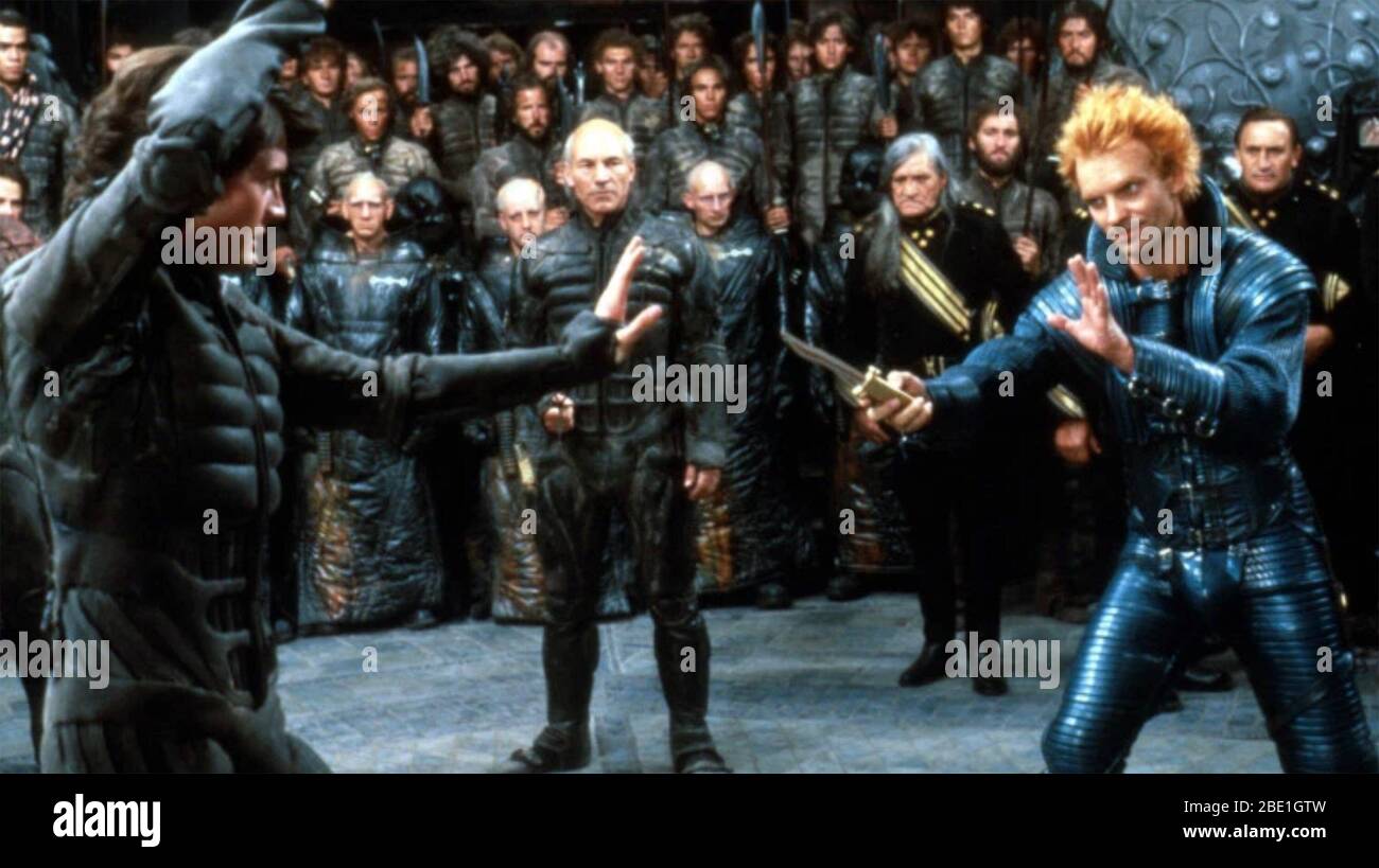 DUNE 1984 Universal Studios sci-fi film with Sting at right watched by Patrick  Stewart as he fights Kyle Machlachlan Stock Photo