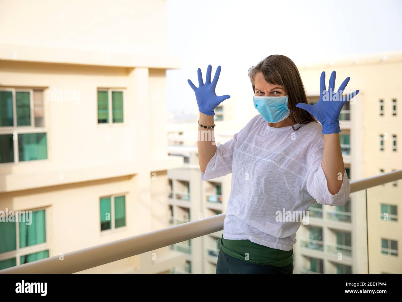 Woman wearing rubber gloves hi-res stock photography and images - Alamy